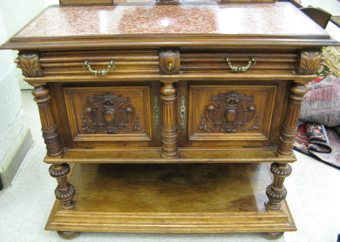 Appraisal: CARVED WALNUT SIDE CABINET Renaissance Revival design Continental c The