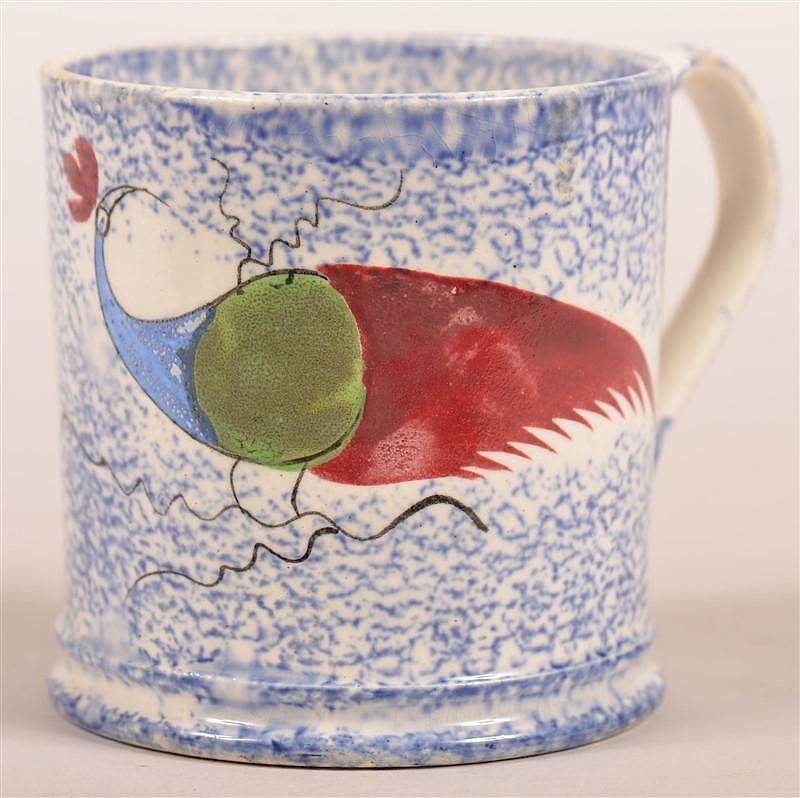 Appraisal: Blue Spatter Peafowl Pattern China Child's Mug Blue Spatter Peafowl