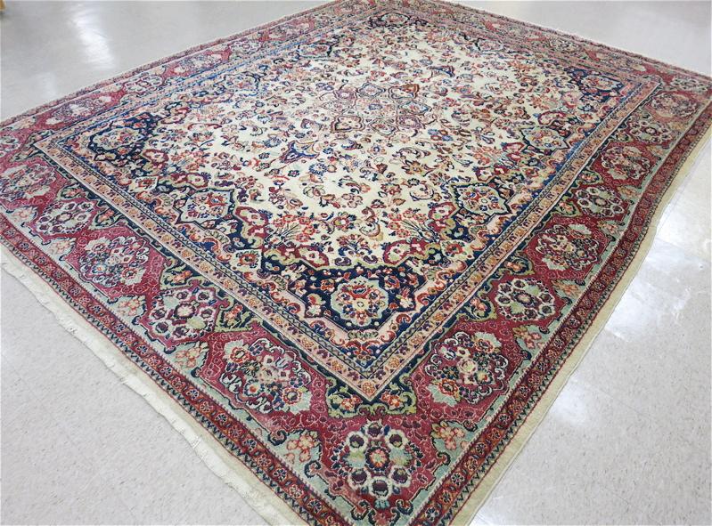 Appraisal: SEMI-ANTIQUE PERSIAN CARPET floral and central rosette medallion design on