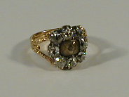 Appraisal: A Victorian memorial ring a central crystal windowed hair insert