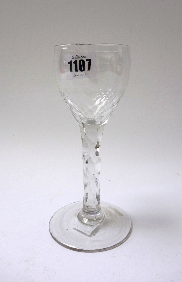 Appraisal: A facet cut wine glass circa with rounded bowl and