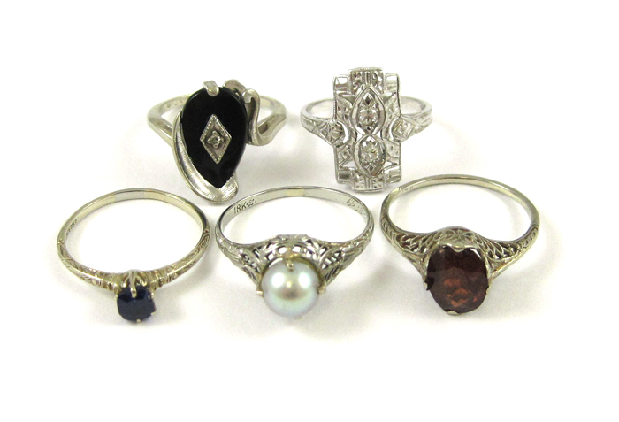 Appraisal: COLLECTION OF FIVE WHITE GOLD RINGS including an k gold