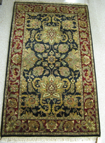 Appraisal: A PAIR OF ORIENTAL AREA RUGS Indo-Persian hand knotted in