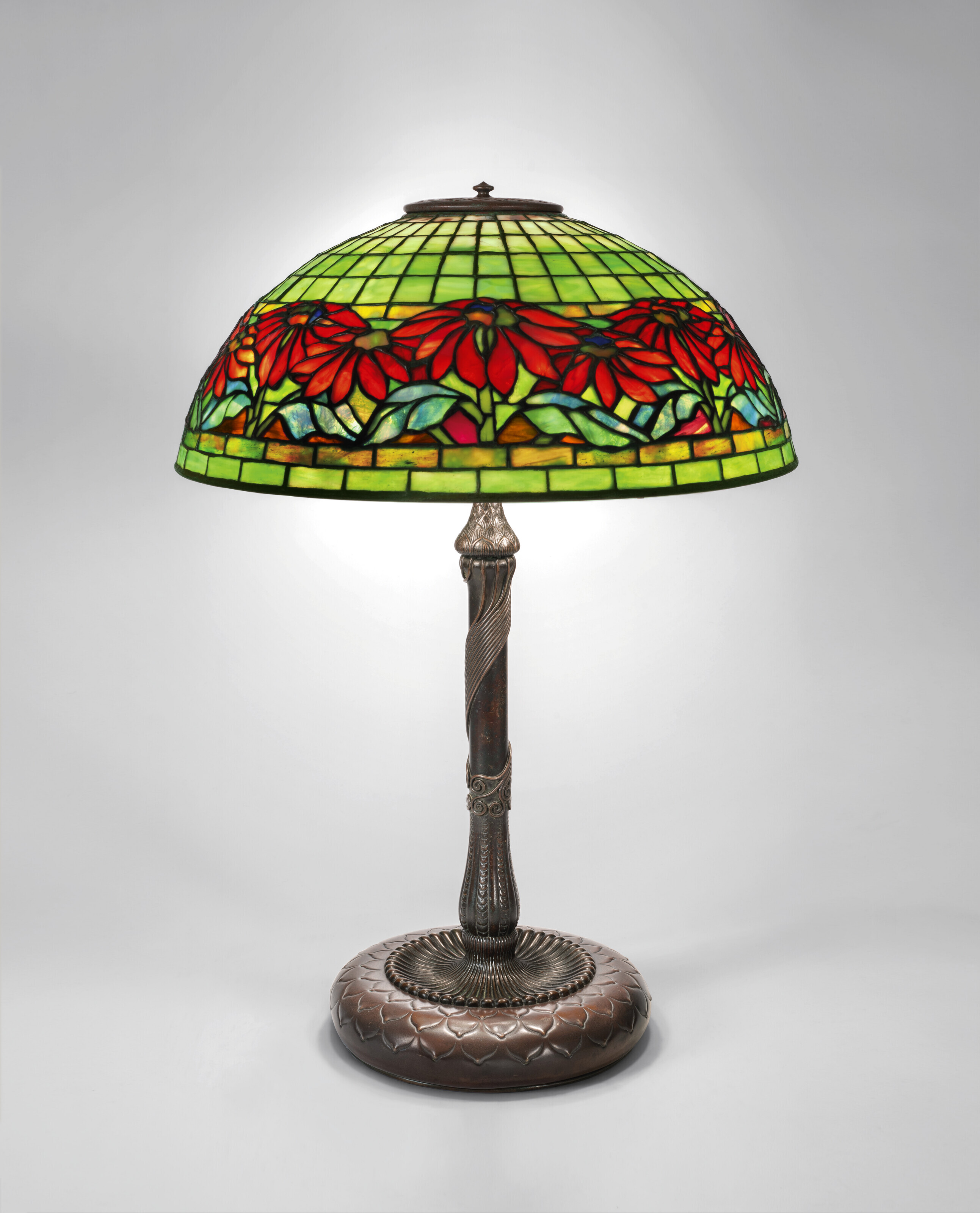 Appraisal: TIFFANY STUDIOS 'Poinsettia' Table Lamp circa leaded glass patinated bronze