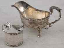 Appraisal: A silver sauceboat Chester and a silver mustard pot Birmingham