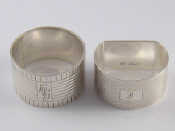 Appraisal: Two silver napkin rings a D shaped engine turned ring