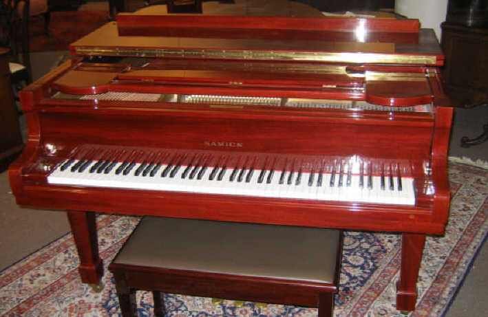 Appraisal: SAMICK GRAND PIANO AND BENCH Polished mahogany model SG serial