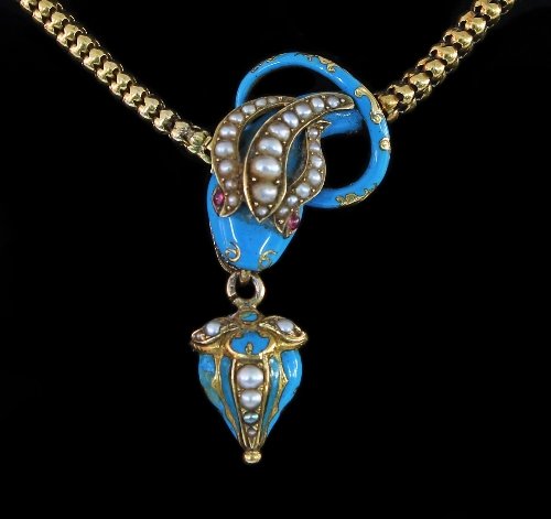 Appraisal: A Victorian serpent necklace the snake head with ruby eyes