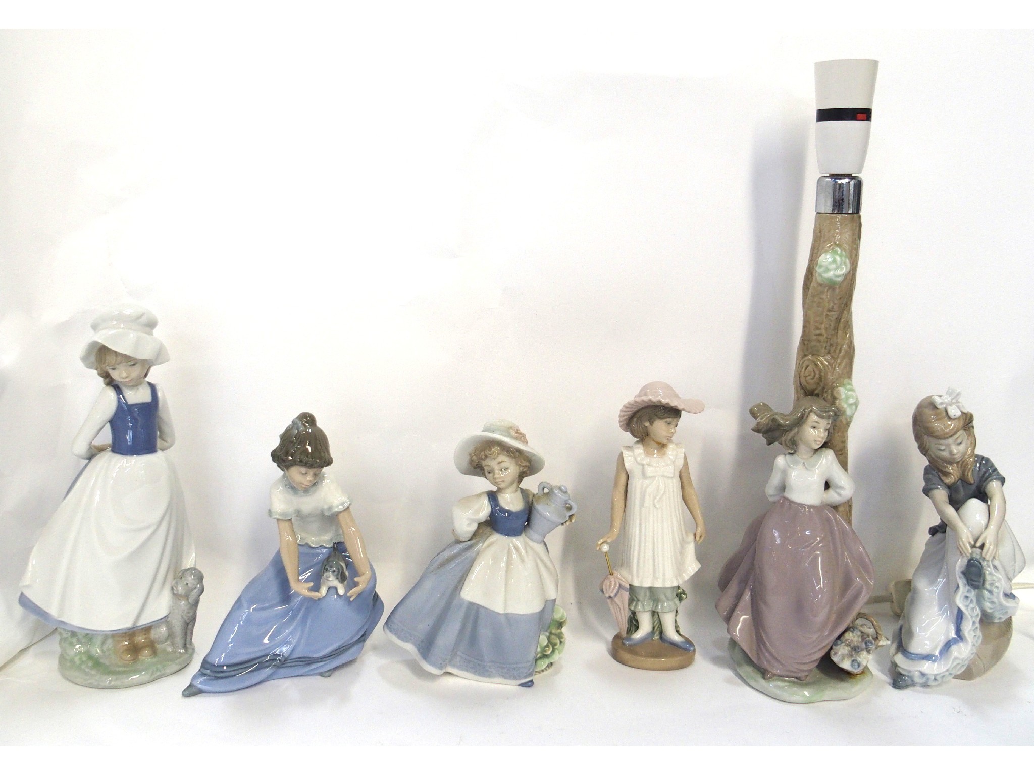 Appraisal: Six Nao figures of girls and a Nao table lamp