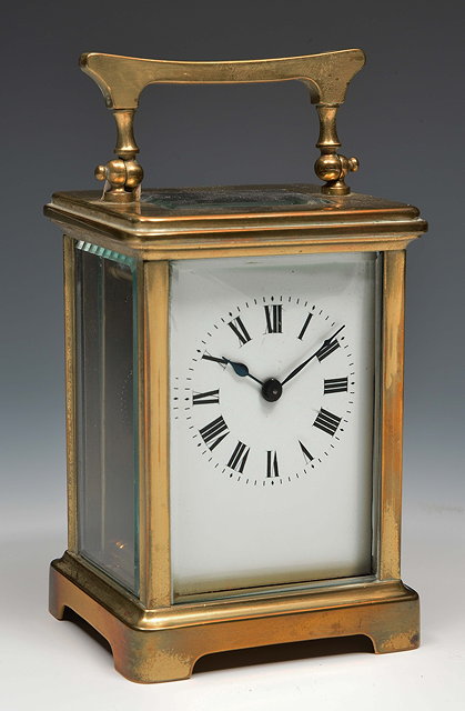 Appraisal: A French brass carriage timepiecewith white enamel Roman dial and