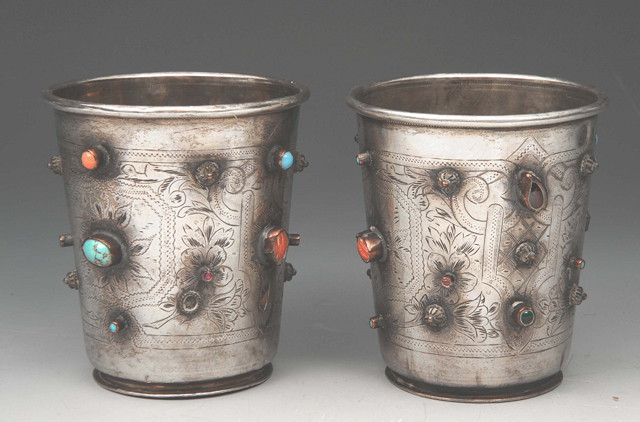 Appraisal: A PAIR OF TURKISH ENGRAVED SILVER BEAKERS of tapering form