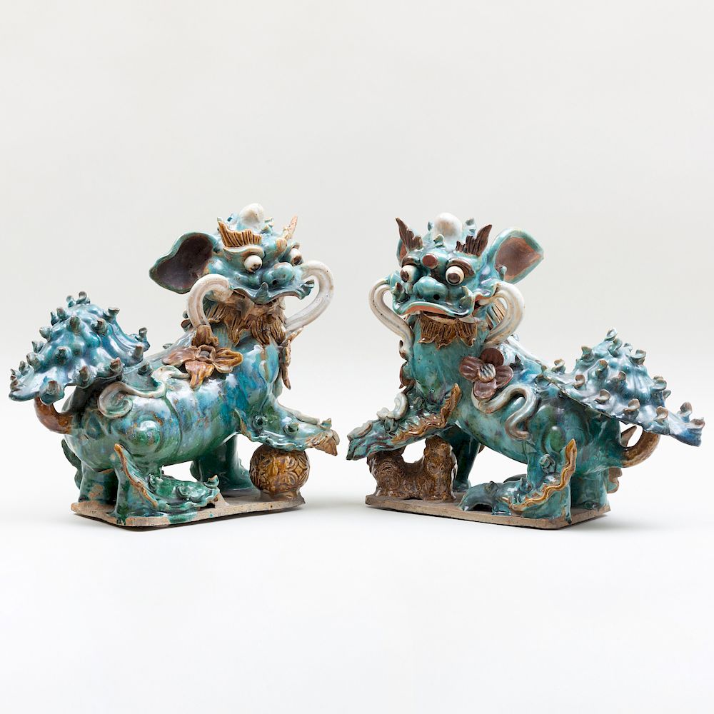 Appraisal: Pair of Chinese Ming Style Pottery Buddhistic Lions Pair of