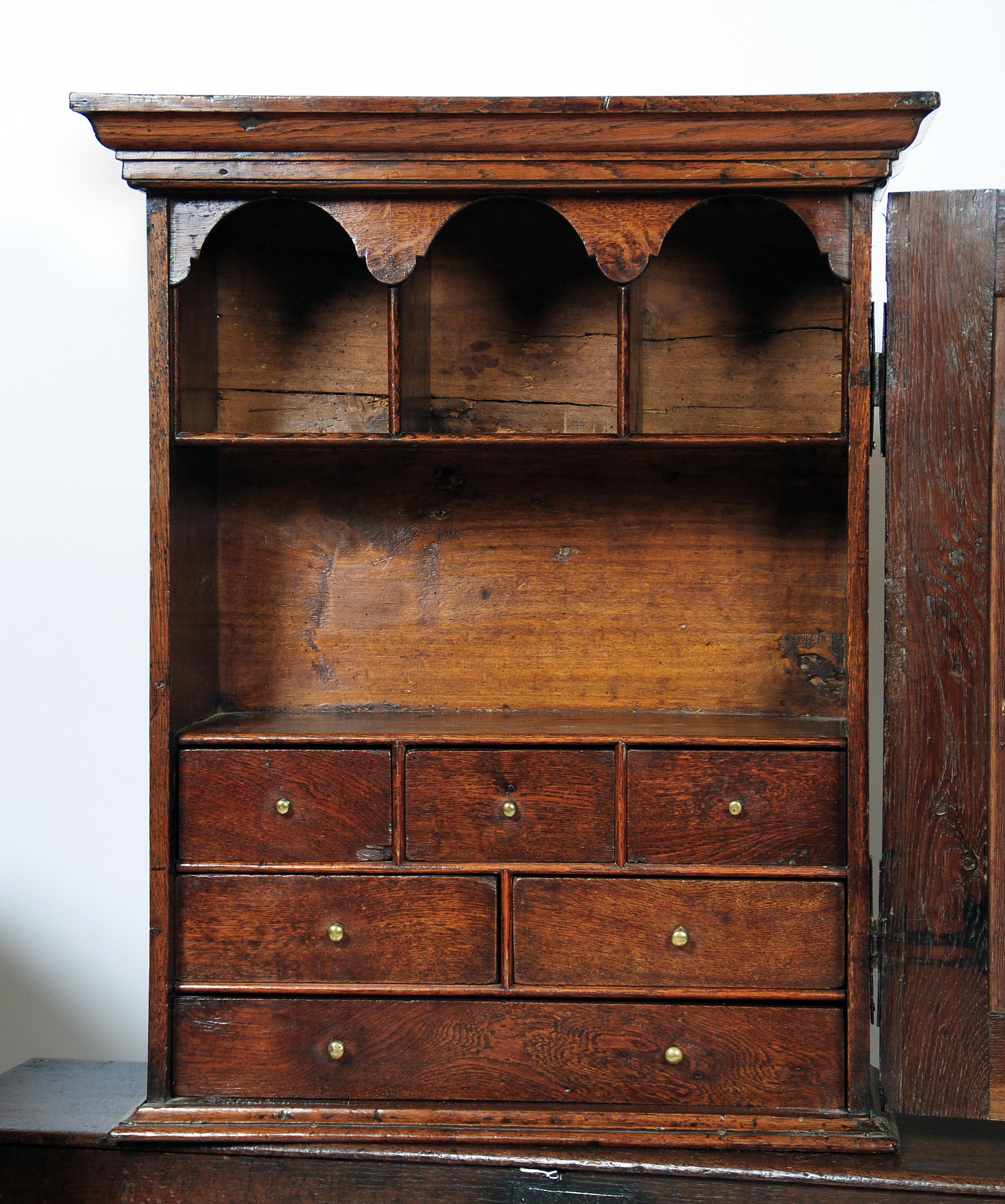 Appraisal: A GEORGIAN OAK SPICE CUPBOARD early th century of oblong