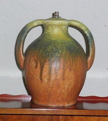 Appraisal: A RUSKIN TWO HANDLED LAMP BASE graduated yellow green drip