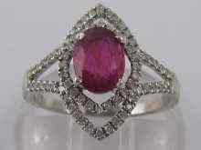 Appraisal: A white metal tests carat gold ruby and diamond ring