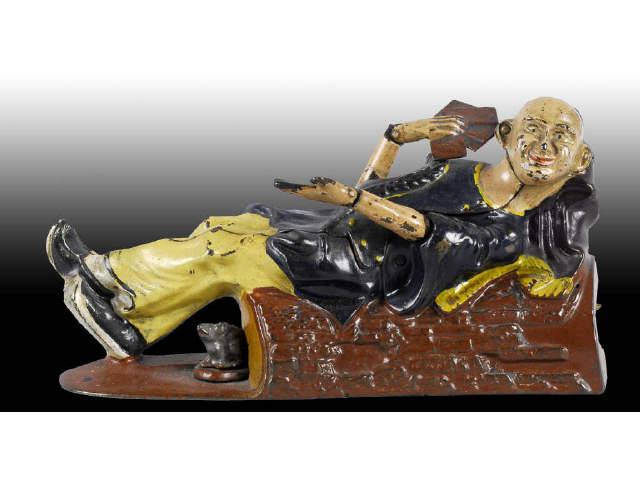 Appraisal: Cast Iron Reclining Chinaman Mechanical Bank Description Manufactured by J