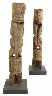 Appraisal: A pair of carved wood Hawaiian tiki totems the top