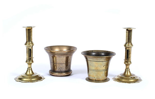 Appraisal: A PAIR OF ANTIQUE BRASS CANDLESTICKS each with shaped circular