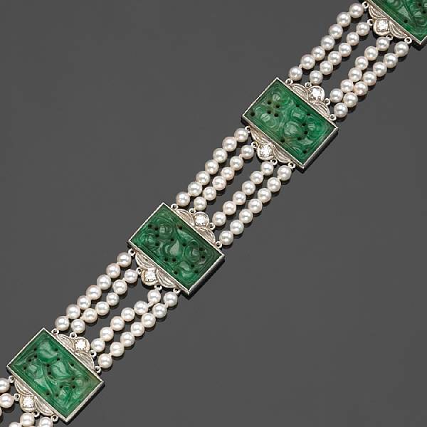 Appraisal: A carved jadeite jade cultured pearl diamond and platinum four