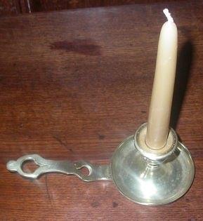 Appraisal: An early th Century brass chamberstick with circular drip pan