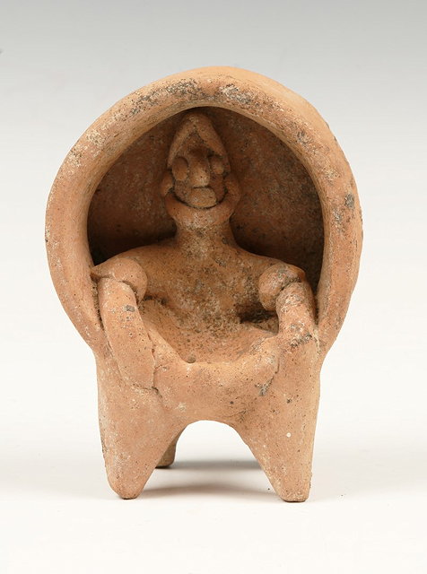 Appraisal: A WEST MEXICO TERRACOTTA FIGURE of a man seated in