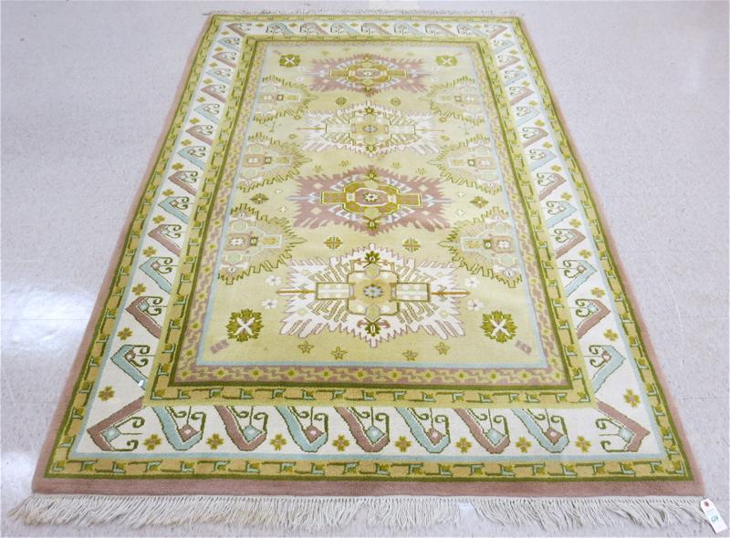 Appraisal: HAND KNOTTED ORIENTAL CARPET Indo-Persian featuring four geometric medallions on