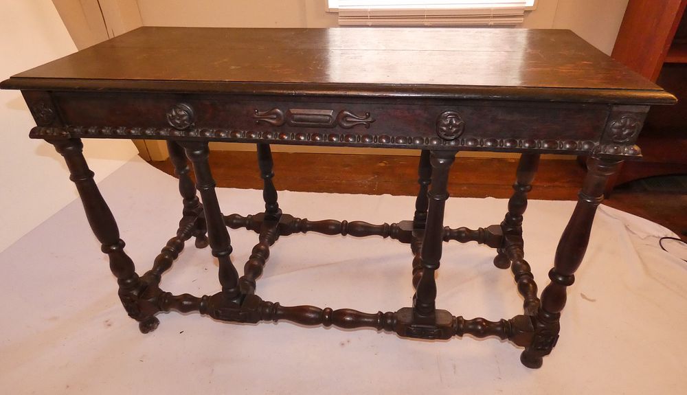 Appraisal: ANTIQUE OAK HALL TABLE th century dark oak Renaissance style