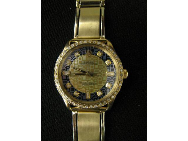 Appraisal: Rolex Man's Wristwatch k gold with diamond bezel fancy dial