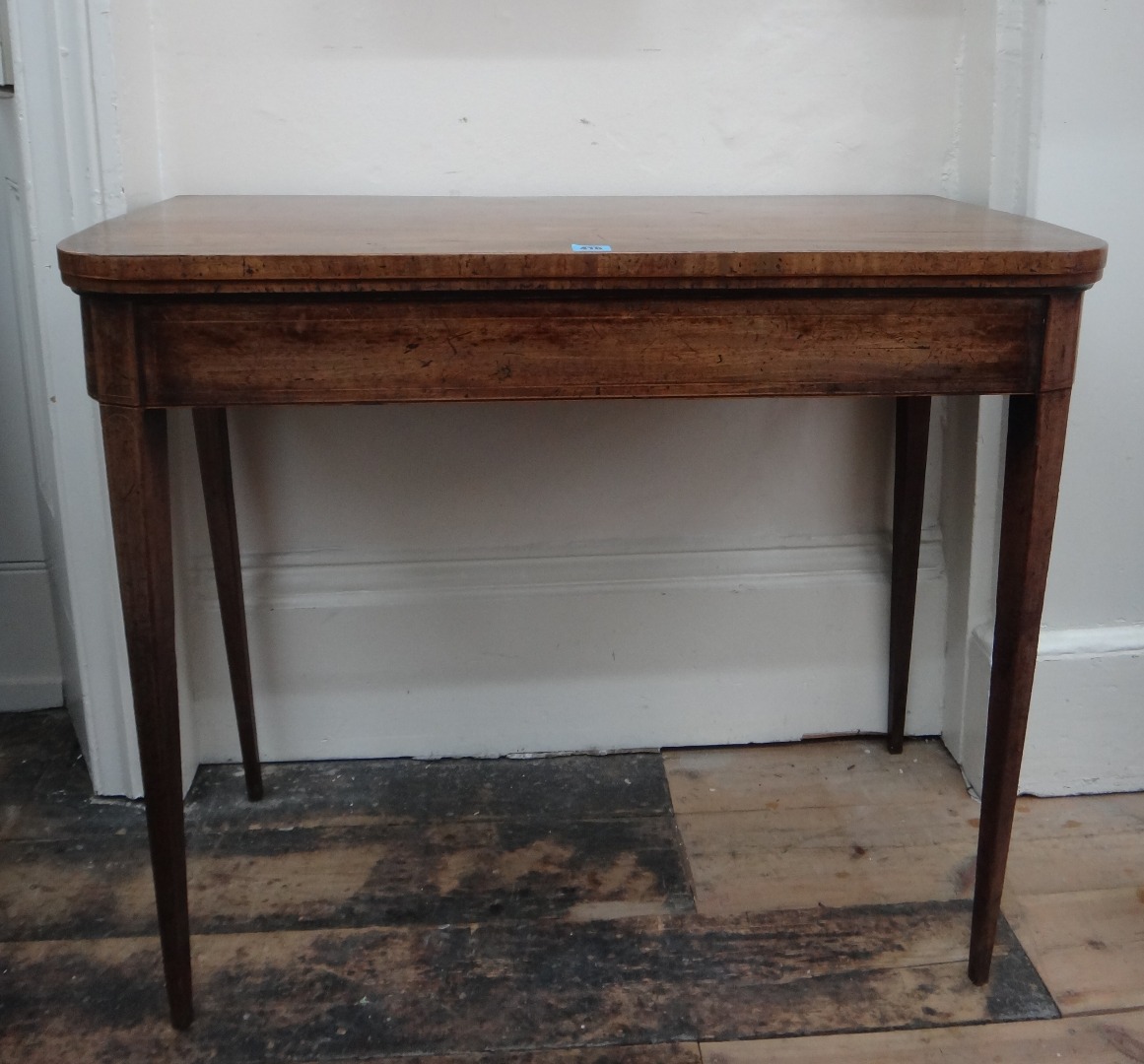 Appraisal: A George III mahogany boxwood banded and strung card table