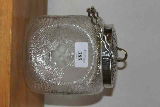 Appraisal: A STYLISED GLASS BISCUIT BARREL with silver plated mount lid