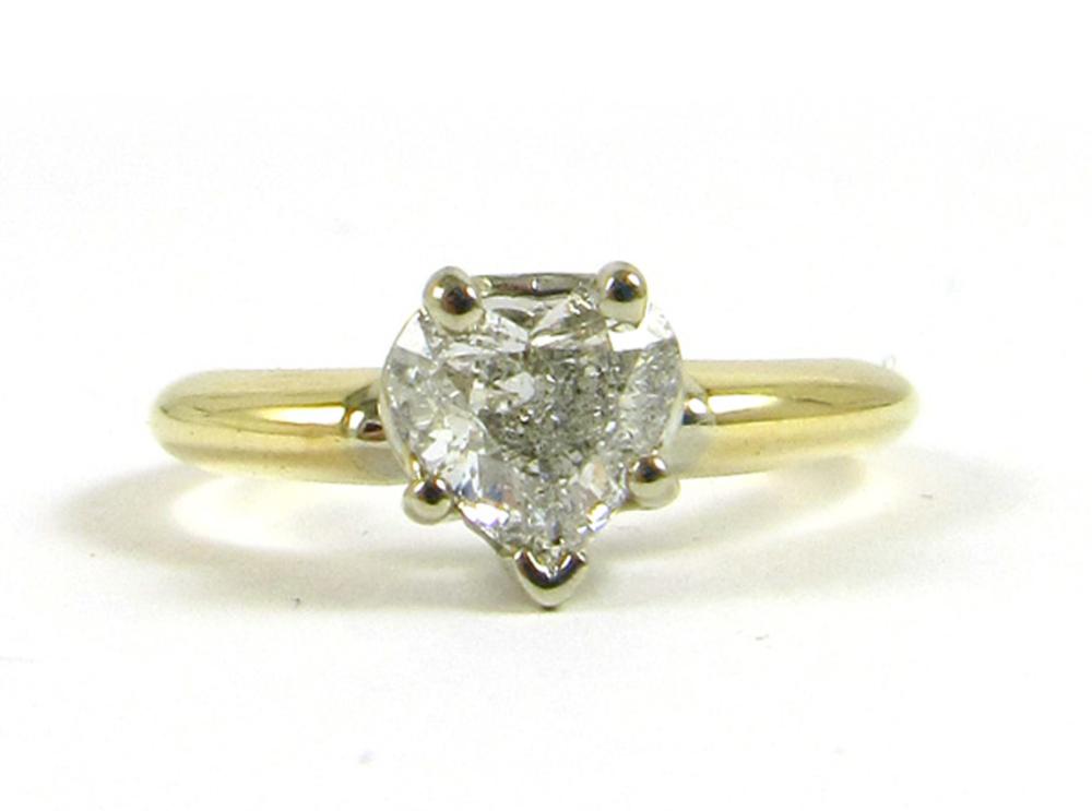 Appraisal: DIAMOND AND FOURTEEN KARAT GOLD SOLITAIRE RING The k yellow