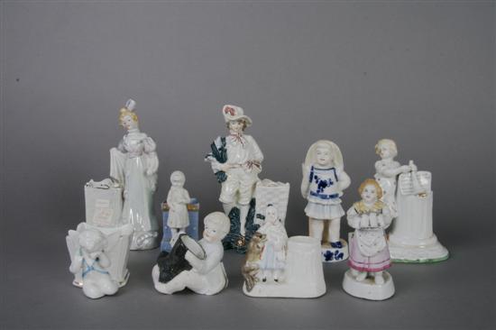 Appraisal: A Collection of Nine Figural Match Strikes Height of tallest