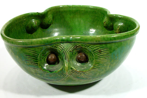 Appraisal: Green glazed Art pottery bowl with owl mask design mouldings