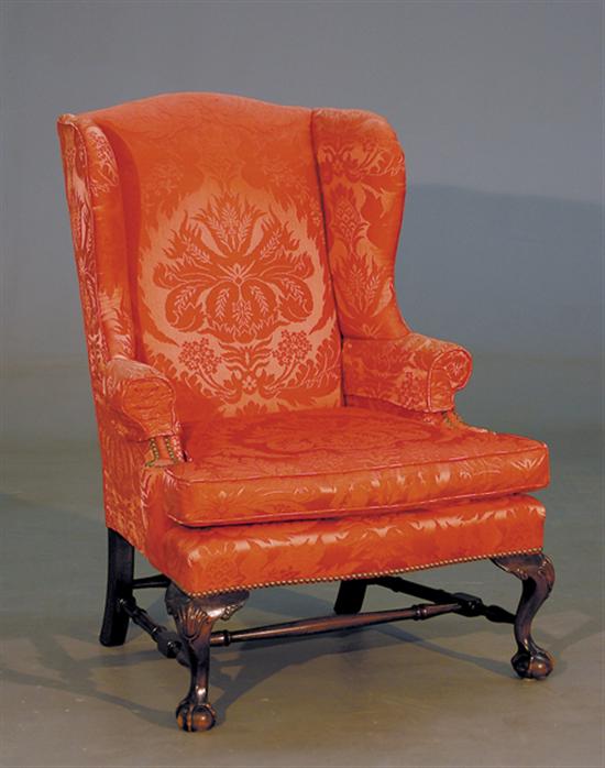 Appraisal: George III style carved mahogany wingback chair early th century