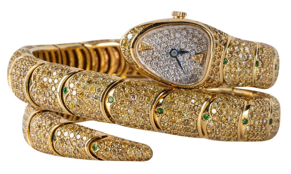 Appraisal: KARAT YELLOW GOLD DIAMOND GARNET SNAKE WATCH BRACELETcontaining round cut