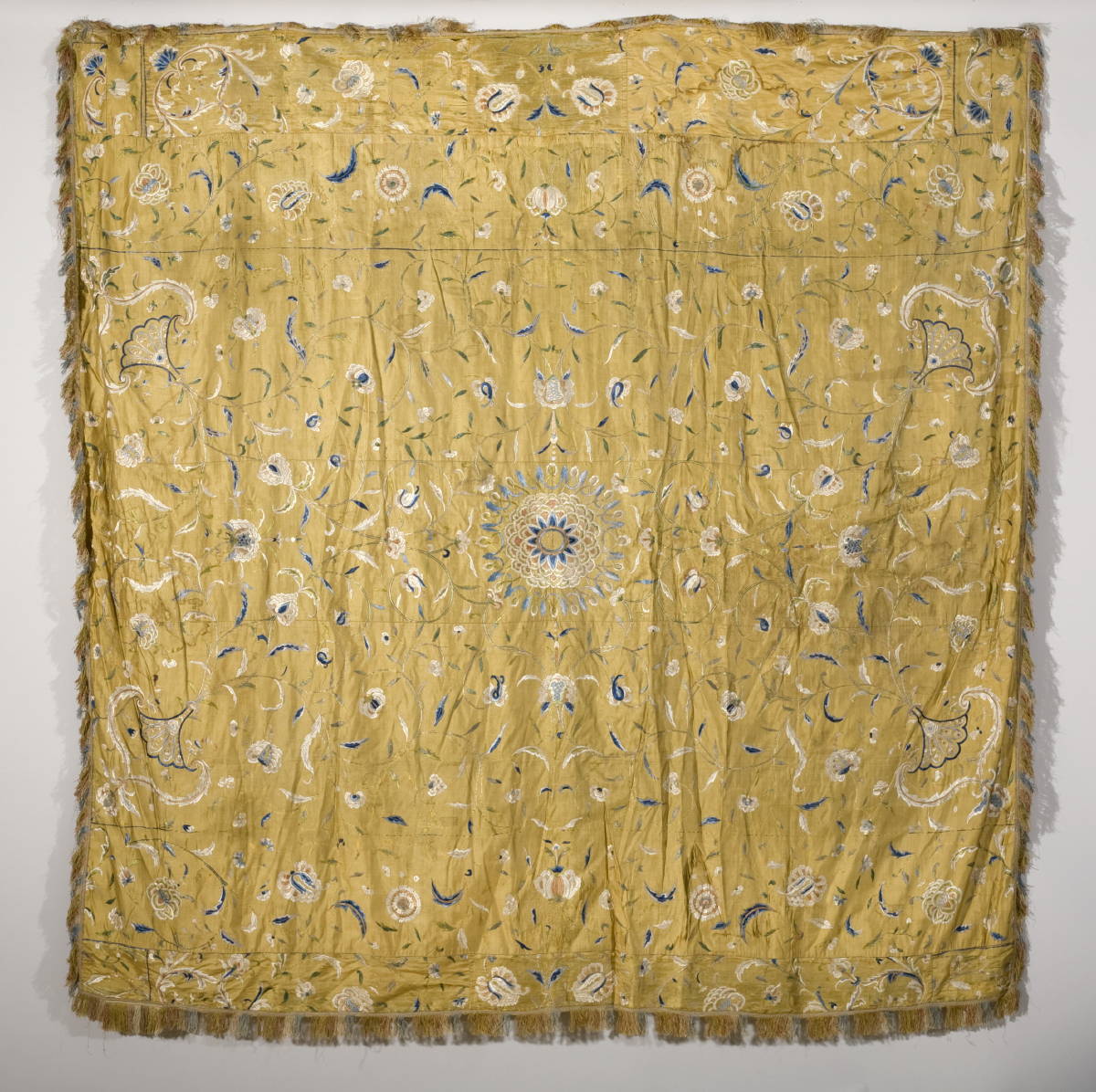 Appraisal: CHINESE FLORAL EMBROIDERED GOLD SILK BED COVER CIRCA Because of