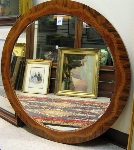 Appraisal: ROUND WALL MIRROR with inlaid kingwood and burl walnut veneer