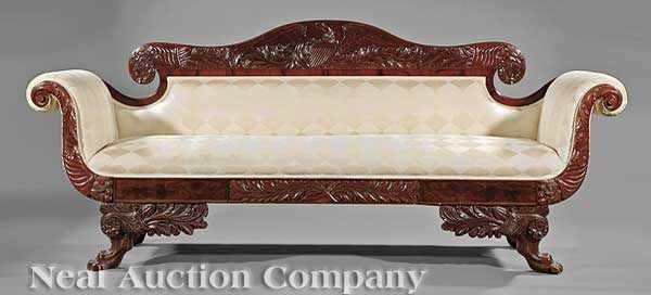 Appraisal: An American Highly Carved Mahogany Sofa mid- th c arched