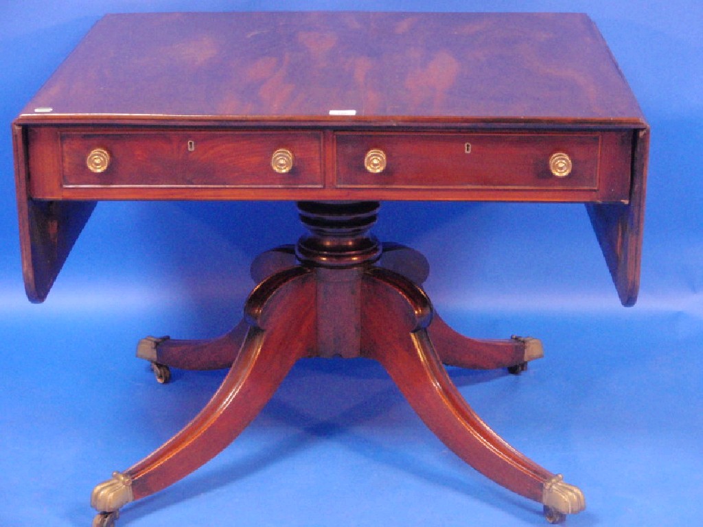 Appraisal: A late Regency mahogany sofa table with two drawers having