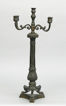 Appraisal: A Five-Light Candleabra A five-light cast brass candleabra finished in