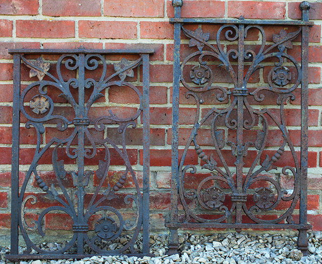 Appraisal: A PAIR OF WROUGHT IRON PANELS with scrolling foliate and