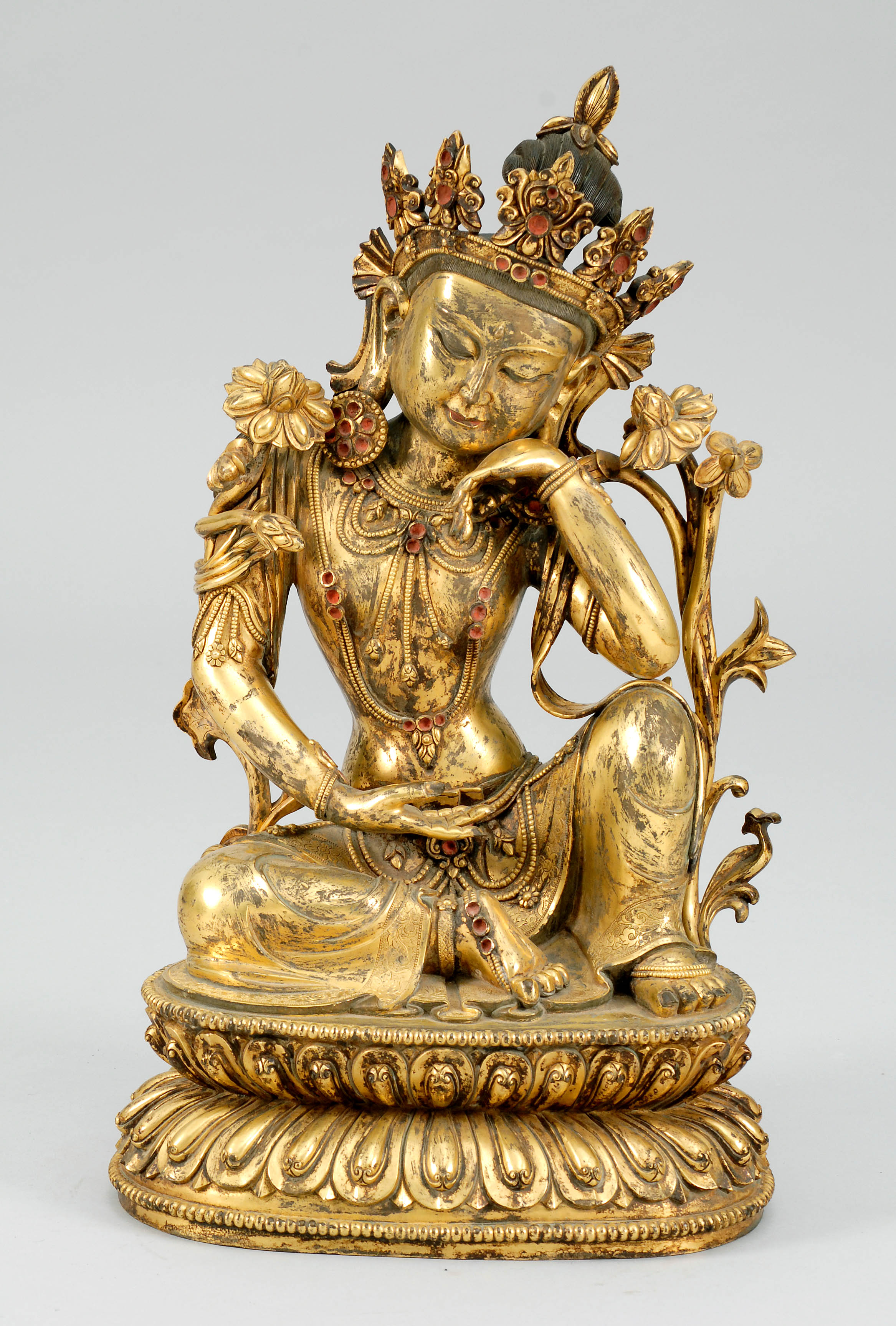 Appraisal: GILT-BRONZE FIGURE OF TARA Seated on a double lotus base