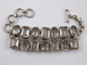 Appraisal: A white metal tests silver rock crystal bracelet approx cm