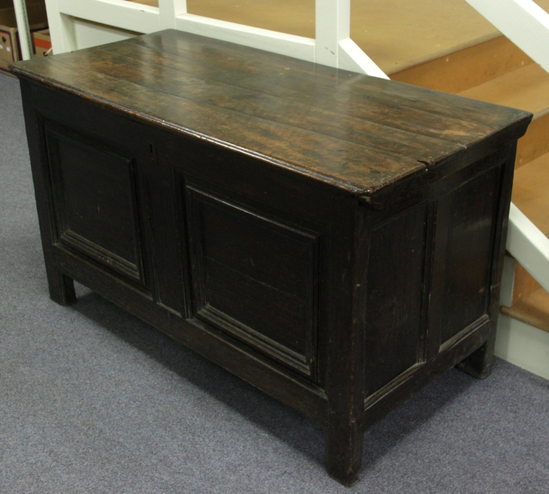 Appraisal: An oak two-panelled coffer with plank lid cm wide