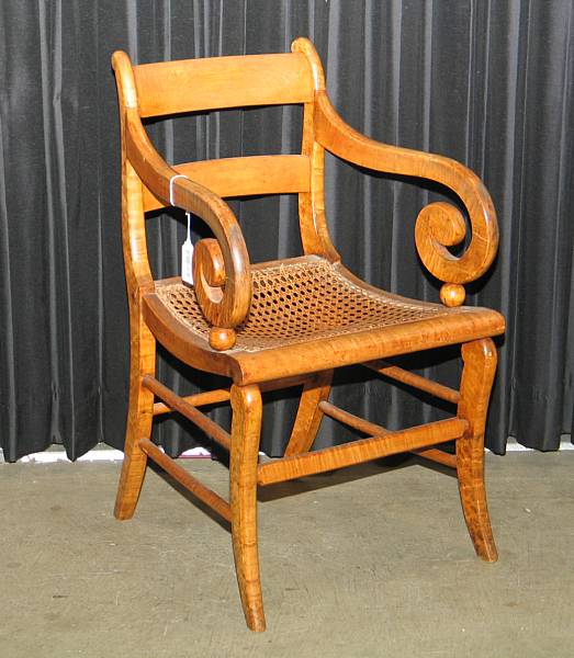 Appraisal: A Classical tiger maple rush seat armchair second quarter th