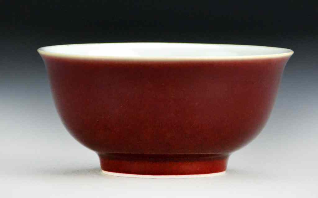 Appraisal: Chinese Monochrome Strawberry Glazed BowlWith slightly flared rim raised on