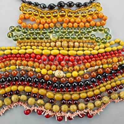 Appraisal: EIGHTEEN STRANDS OF VINTAGE BEADS Includes Bakelite horn resin coral