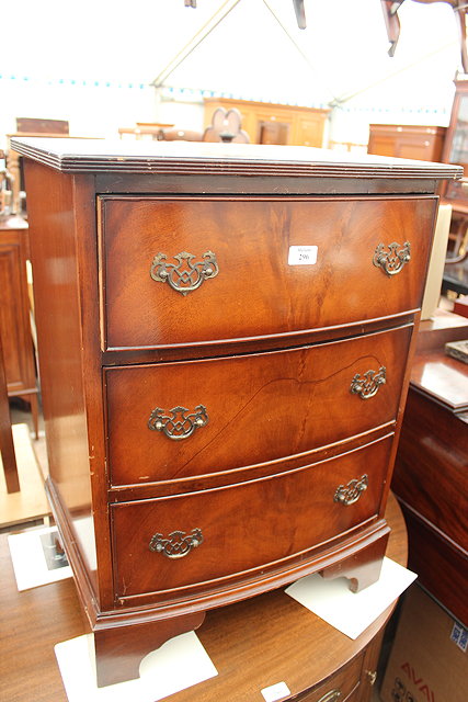 Appraisal: A REPRODUCTION MAHOGANY BOW FRONT THREE DRAWER BEDSIDE CHEST inches