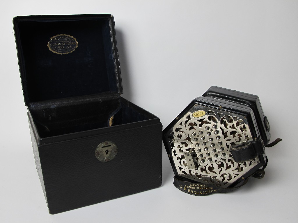 Appraisal: A Wheatstone concertina the pierced foliate plated panels inset with