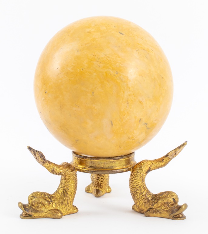 Appraisal: MARBLE SPHERE ON GILT BRONZE DOLPHIN FORM STAND Marble stone